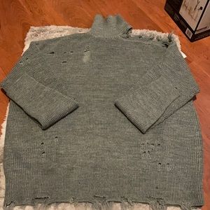 Turtleneck distressed sweater